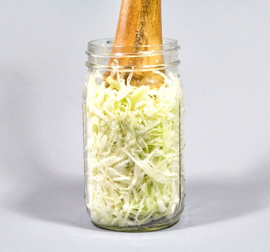Fermented sauerkraut – The traditional German ferment - wooden masher